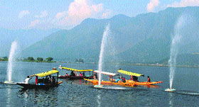 Tourists enjoy shikara rides at the Dal Lake in Srinagar on Sunday.