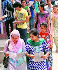 Students come put after appearing in the entrance examination for post graduate courses at Jammy University on Monday.