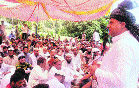 A leader addresses a gathering at Dera-ki-Gali in Rajouri on Monday.