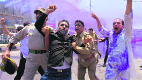 A protester being taken into police custody.