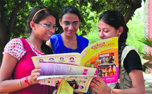 Students read the prospectus at the Government College for Girls in Ludhiana on Monday.