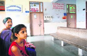 A young girl and her mother at the deserted Amritsar Civil Hospital on Monday