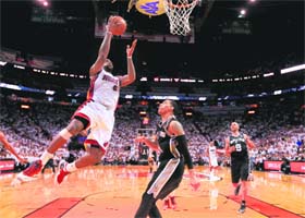 LeBron James scores against the San Antonio Spurs during Game Two of the NBA Finals on Sunday