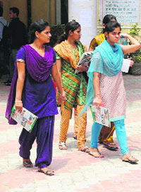 Students come out of Government Rajindra College after buying prospectus for admission on Tuesday.