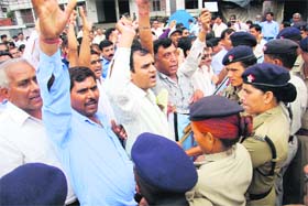 Government teachers of junior high schools protest in support of their demands in front of the Secretarat in Dehradun on Tuesday