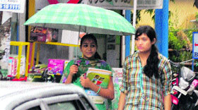 College students during rain in Kangra on Tuesday.