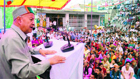 Chief Minister Virbhadra Singh addresses a rally at Karsog in Mandi on Tuesday.