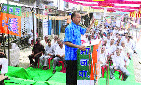 BJP candidate Jai Ram Thakur addresses a public meeting at Drang on Tuesday.