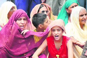 Miran Sahib residents block RS Pura Satwari road, in Jammu on Tuesday.