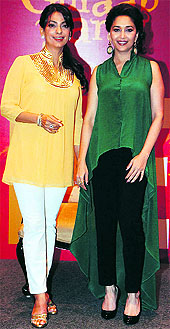 uhi Chawla and Madhuri Dixit (in an asymmetric dress) at one of the recent events