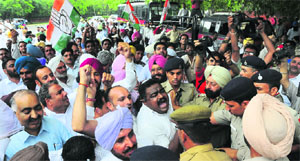 Congress workers from Patiala district protest against Education Minister Sikander Singh Maluka in Chandigarh on Tuesday.