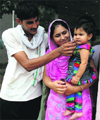 Mohinder Singh and Kulwant Kaur of Bir Talab, whose marriage was saved by police counselling, in Bathinda on Tuesday.