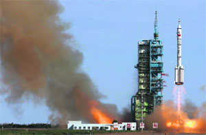 The Long March 2-F rocket loaded with Shenzhou-10 manned spacecraft lifts off from the launchpad in the Jiuquan Satellite Launch Centre, Gansu province in China, on Tuesday
