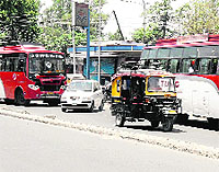 Vehicles ply on a road in Amritsar