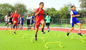 Girls during a training session at the hockey stadium of Government Rajindra College in Bathinda. 
