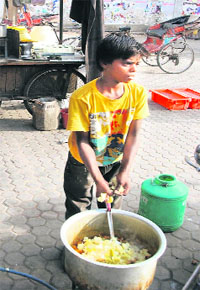 A child labourer at work in the city.