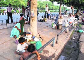 Illegal possession: Migrants encroach upon a footpath at Sector 9 in Panchkula