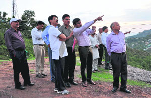 Central University team members inspect a site at Dehra on Wednesday.