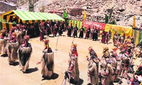 Artistes present folk dance at a cultural festival at Darchiks village in Kargil on Wednesday