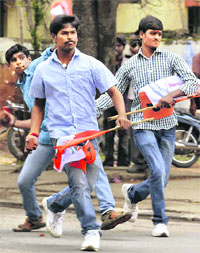 Pro-Telangana Osmania University students throw stones at the police after they were stopped from taking out a rally in Hyderabad on Wednesday.