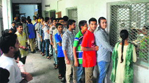 Students in a queue waiting for their turn to buy prospectus for admission at Government Rajindra College in Bathinda on Thursday.