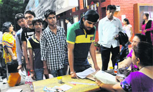 Students submit admission forms at Government Senior Secondary School, Sector 20, in Chandigarh on Thursday. 
