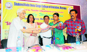 Dignitaries during a seminar at Shaheed Baba Deep Singh College of Education, Aherwan, Fatehabad.