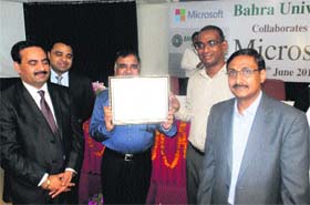 A Bahra University team with Microsoft officials after signing an MoU at Bahra University, Waknaghat, on Thursday