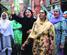Supervisors of the Integrated Child Development Services scheme protest non-payment of salaries in Srinagar on Thursday.