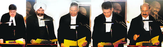 From left: Punjab and Haryana High Court Chief Justice Sanjay Kishan Kaul administers oath to Justice Paramjeet Singh, Justice Naresh Kumar Sanghi and Justice Rameshwar Singh Malik as permanent Judges and Justice Bharat Bhushan Parsoon as Additional Judge, in Chandigarh on Thursday .