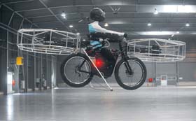 This photo taken on Wednesday at the hall of Letnany fairground in Prague, Czech Republic, shows a dummy sitting on the flying bike