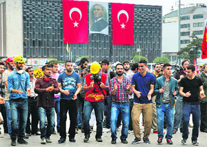 Protesters dance at the Gezi Park in Istanbul's Taksim Square on Thursday. 