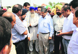 Chief Parliamentary Secretary and Bathinda (urban) MLA Sarup Chand Singla during his visit to the railway under bridge on the Bathinda-Mansa road on Friday.