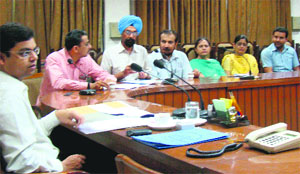Assistant Deputy Commissioner (Development) Mohammad Tayyab (extreme left) interacts with district education officials during a meeting in Bathinda on Friday. 