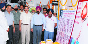 Civil Surgeon Ajay Sahni along with Senior Medical Officer Satish Goyal and the Secretary, Red Cross, Colonel Mukhtiar Singh observe the World Blood Donor Day at the Blood Bank of the Civil Hospital in Bathinda on Friday. 