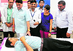 Health Minister Surendra Singh Negi interacts with a blood donor after inaugurating a camp organised on World Blood Donation Day in Haridwar on Friday