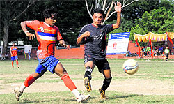 A match in progress during the 4th ONGC BS Negi Memorial Football Tournament in Dehradun on Friday