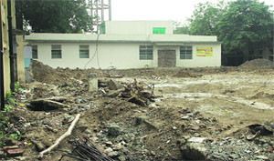 Mounds of construction material lie near the Maternity Ward