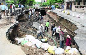 MISSION RESTORATION: A day after the cave-in, MC workers repair the road at Kitchlu Nagar in Ludhiana on Friday