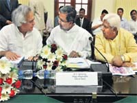 Union Minister for Rural Development and Panchayati Raj Jairam Ramesh (L) with Karnataka CM Siddaramaiah (C) and HK Patil in Bangalore on Friday