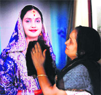 Surjit Kaur remembers her daughter, who was killed by her husband in Canada, at her house in Rajpura on Friday
