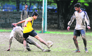 Players in action during a football match at Sector 17 in Chandigarh on Saturday.