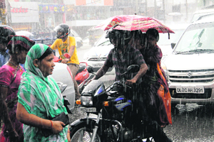 Commuters face a tough time driving in the heavy downpour.