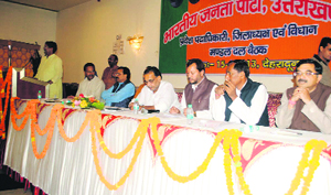 State BJP in charge Radha Mohan Singh and other senior party leaders at a meeting of legislators, office-bearers and district presidents in Dehradun on Saturday.