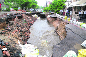The pit created by a cave-in on the Kitchlu Nagar road further expanded in Saturdays rain.