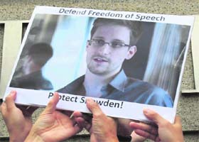 Protesters supporting Edward Snowden during a demonstration outside the US Consulate in Hong Kong on June 13