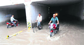 Commuters face trobule crossing the Paras Ram Nagar railway under bridge (RUB) every time it rains in Bathinda as rainwater accumulates on the low-lying area of the road on which the RUB has been built.