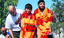 Wrestlers Prabhpal (right) and Santosh Kumar being felicitated at a function in Zirakpur on Sunday