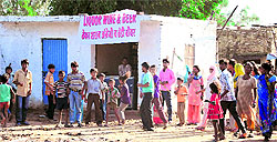 Residents hold a protest in front of a liquor vend opposite the Sector 43 bus stand in Chandigarh