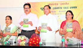 Uttarakhand Revenue Minister Yashpal Arya releases a collection of poems by Veena Pani Joshi in Dehradun on Sunday